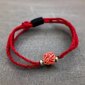String and red thread bracelets for protection